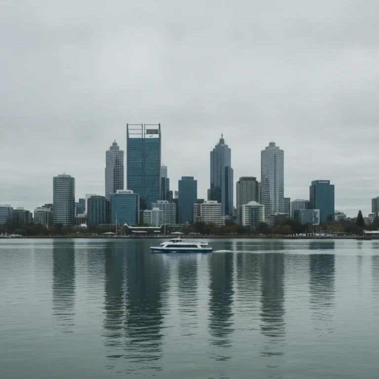 Perth skyline across the Swan River under an overcast grey sky
