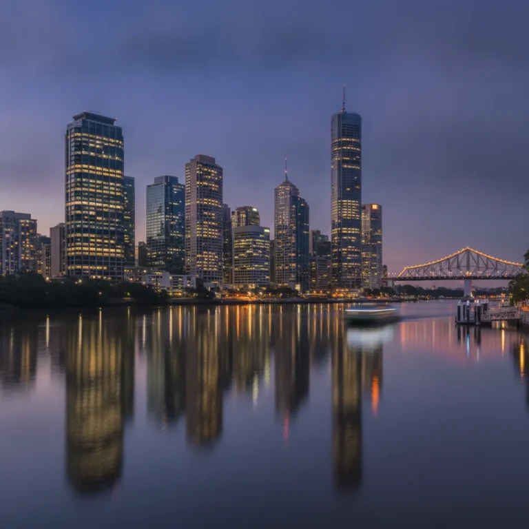 Brisbane CBD skyline and river at blue dusk with lit towers and ferry light trails